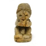 A Polynesian carved stone seated figure,