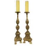 A pair of Italian carved wooden pricket candlesticks,
