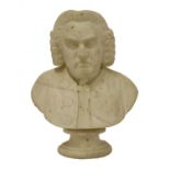 A carved marble bust of a gentleman, possibly Samuel Johnson