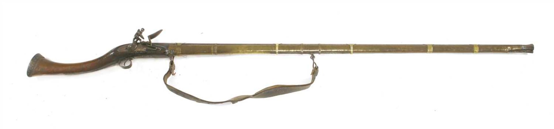 A flintlock long gun,