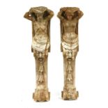 A pair of carved wood caryatid brackets,
