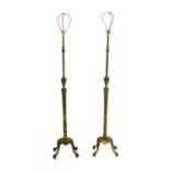 A near pair of brass adjustable standard lamps,
