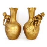 A pair of gilt metal baluster vases,