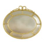 A Victorian gilt-framed oval mirror,