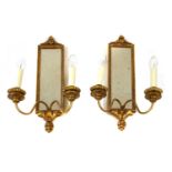 A pair of giltwood mirror backed girandoles