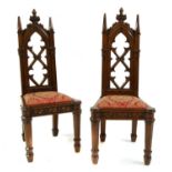 A pair of Gothic oak hall chairs