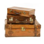 Three leather suitcases,