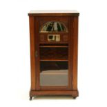 An Edwardian walnut music cabinet,