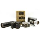 A large collection of cameras and lenses,