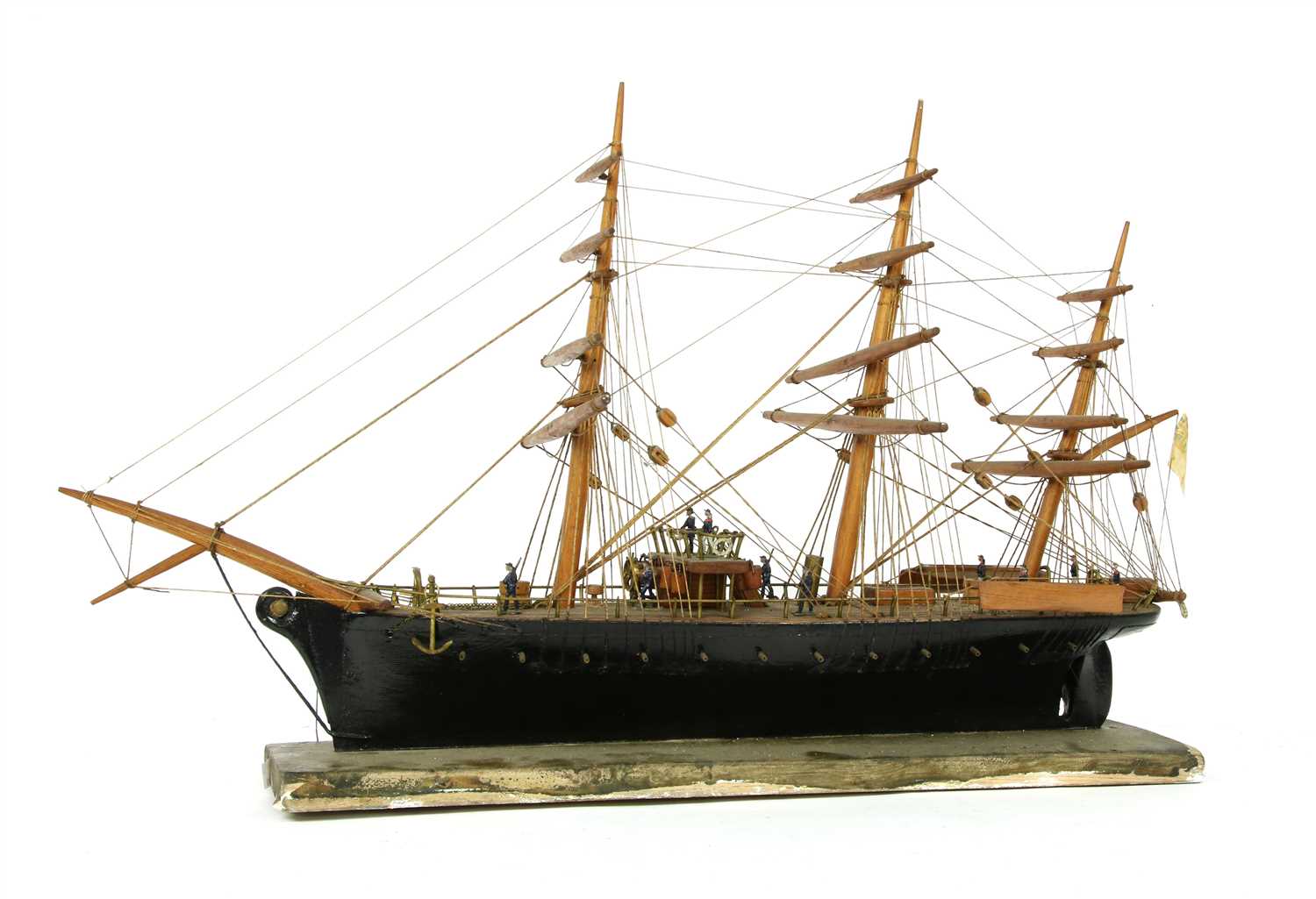 A wooden and ebonised model of a sailing ship,