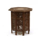 A carved octagonal occasional table,