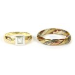 A gold three colour twisted band ring,