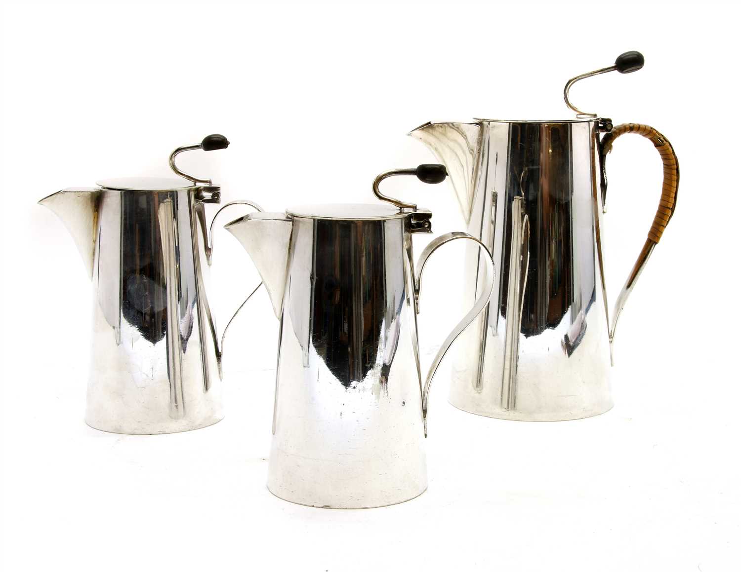 A set of three silver plated Asprey bean terminal coffee and milk pots,