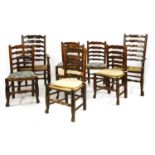 A set of eight oak and elm ladder back dining chairs,