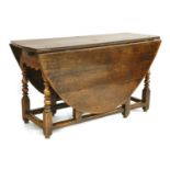 An oak gateleg table,