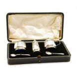 A cased silver cruet set,