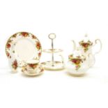 A large collection of Royal Albert Country Rose dinner and tea services,