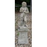 A composition stone figure of a boy