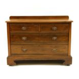 A large Edwardian walnut chest of two short above two long drawers,