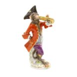 A Meissen porcelain monkey band figure playing the French horn