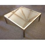 A brass and chrome coffee table,