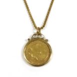 A half sovereign pendant,