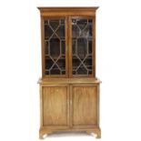 A mahogany and cross banded bookcase cabinet,