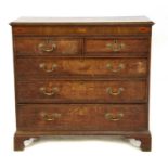 A George III oak chest of two short over three long drawers