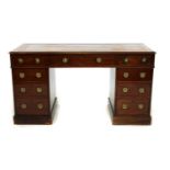 An early Victorian mahogany pedestal desk