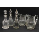 A pair of antique cut glass water jugs,