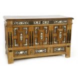 An inlaid oak coffer,