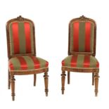 A pair of French walnut side chairs,