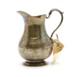 A George II silver cream jug,