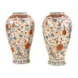 A pair of large Imari style temple vases and covers,