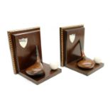 A pair of golf club book ends,