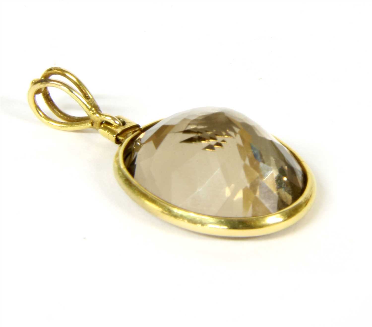 A gold smokey quartz pendant,