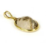 A gold smokey quartz pendant,