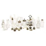 A collection of various mid 19th century cut glass cruets,