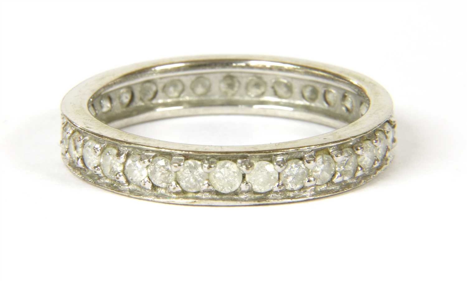 A 9ct white gold diamond eternity ring,