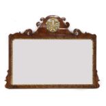 A walnut overmantel mirror,