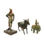 A parcel gilt bronze figure of Indra riding Grawan the three headed elephant,