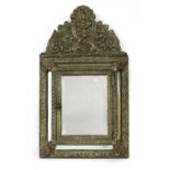 A brass and mirrored shallow cabinet,