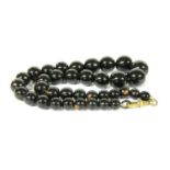 A single row graduated round tortoiseshell bead necklace,