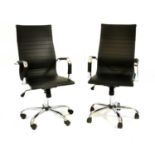 A pair of Eames style chromed office chairs