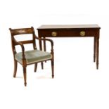 A George III mahogany writing table and desk chair,