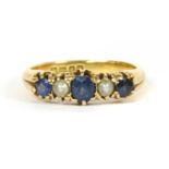 An 18ct gold five stone sapphire and split pearl ring,