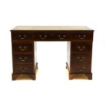 A reproduction mahogany nine drawer twin pedestal desk,