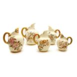 A group of five Royal Worcester porcelain flat back jugs,
