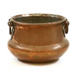 An early 20th Century copper twin handled waisted pot