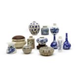 A collection of miniature Chinese porcelain and pottery vessels,